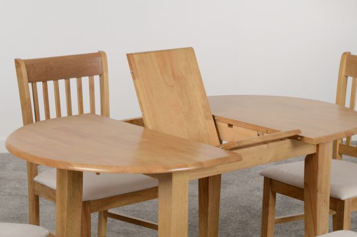 400-401-065_03_1 - Jamies Furniture Wooden dining table with an open leaf extension mid-setup, surrounded by matching wooden chairs.