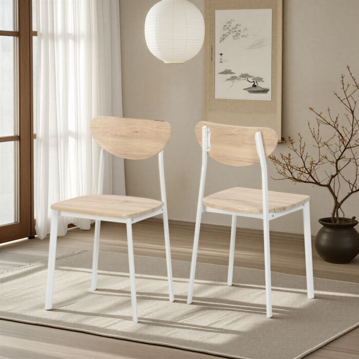 Two light wood and white metal chairs set in a bright, minimalist room with a hanging paper lantern.