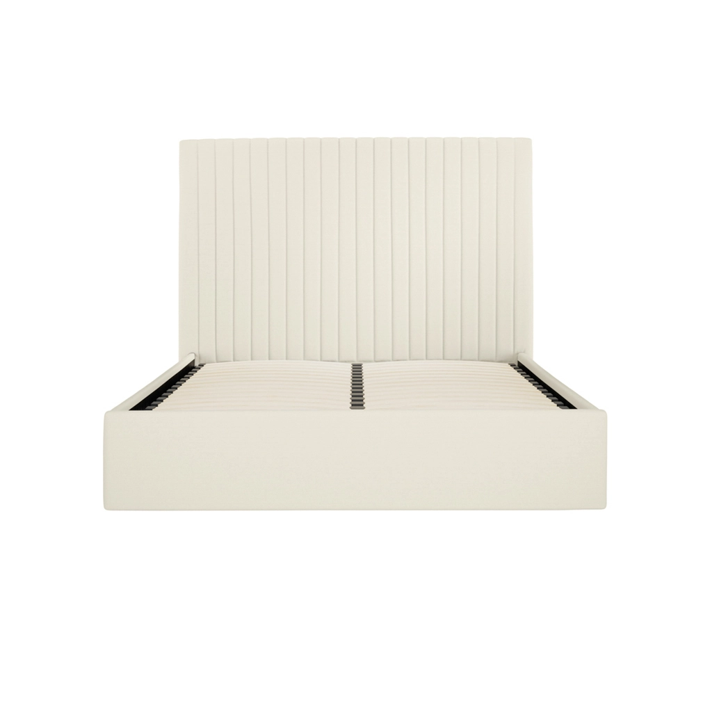 White upholstered bed frame with a tall vertical channel-tufted headboard and slatted base (no mattress).