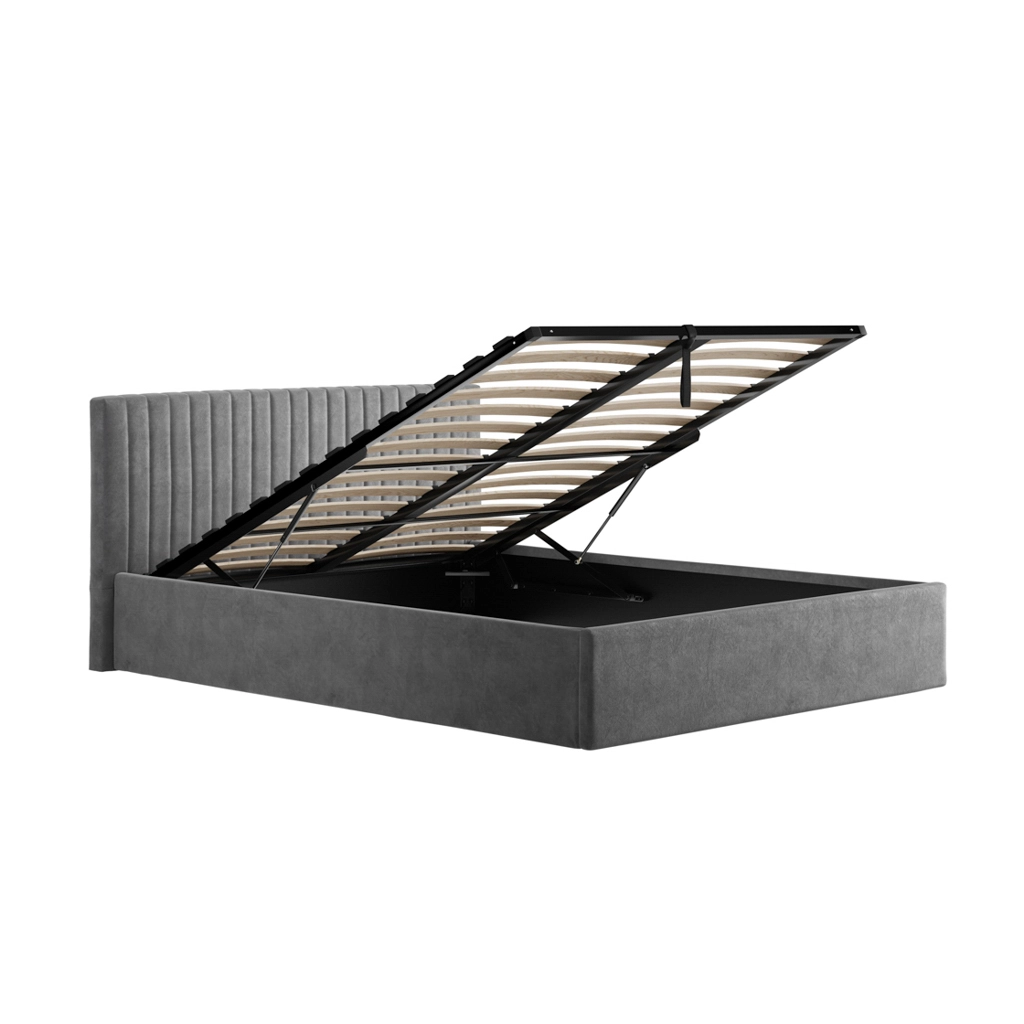 Grey upholstered platform bed with a hinged, lift-up storage base raised to reveal under-bed storage space (storage bed). They show a tall tufted headboard and a gray fabric frame with a gas-lift mechanism.
