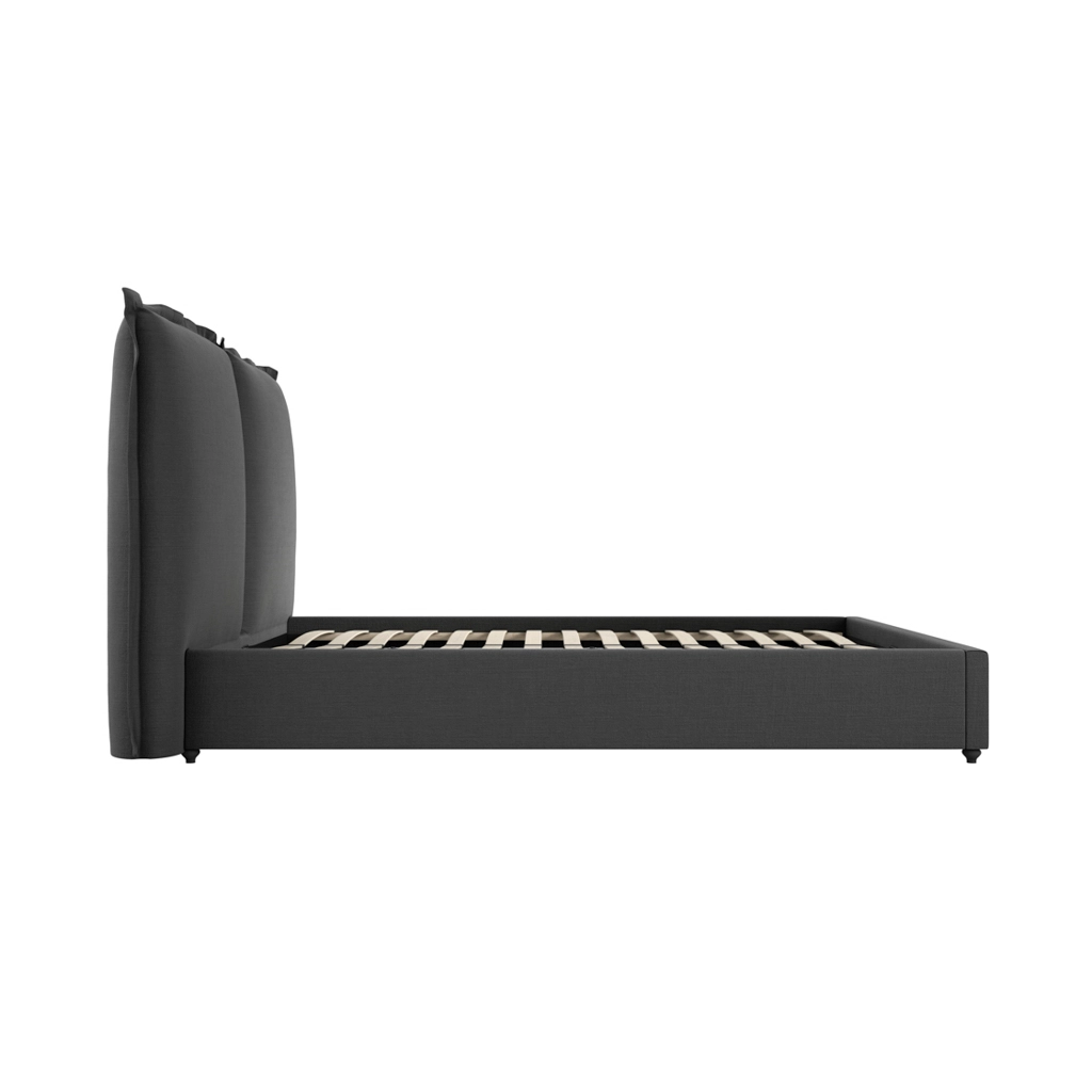 Sunday-Deep-Grey-King-Bed-3 - Jamies Furniture Dark gray upholstered bed frame with a tall padded headboard and slatted base, shown from the side.